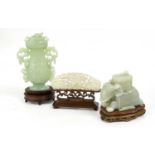A Chinese Jade Box and Cover, in the form of a recumbent elephant with a howdah 11cm long,