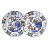 A Pair of Dutch Delft Chargers, 18th century, decorated in polychrome enamels with a bird perched on