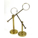 A Victorian Brass Bull's Eye Desk Magnifying Glass, of cantilever form wth gimbal hinge and circular