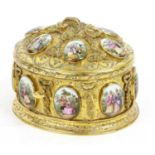 A French Porcelain-Mounted Gilt Metal Casket, in Louis XV style, of oval form, cast and applied with