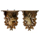 A Pair of Black Forest Carved and Painted Wood Wall Brackets, late 19th/20th century, each with