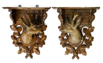 A Pair of Black Forest Carved and Painted Wood Wall Brackets, late 19th/20th century, each with