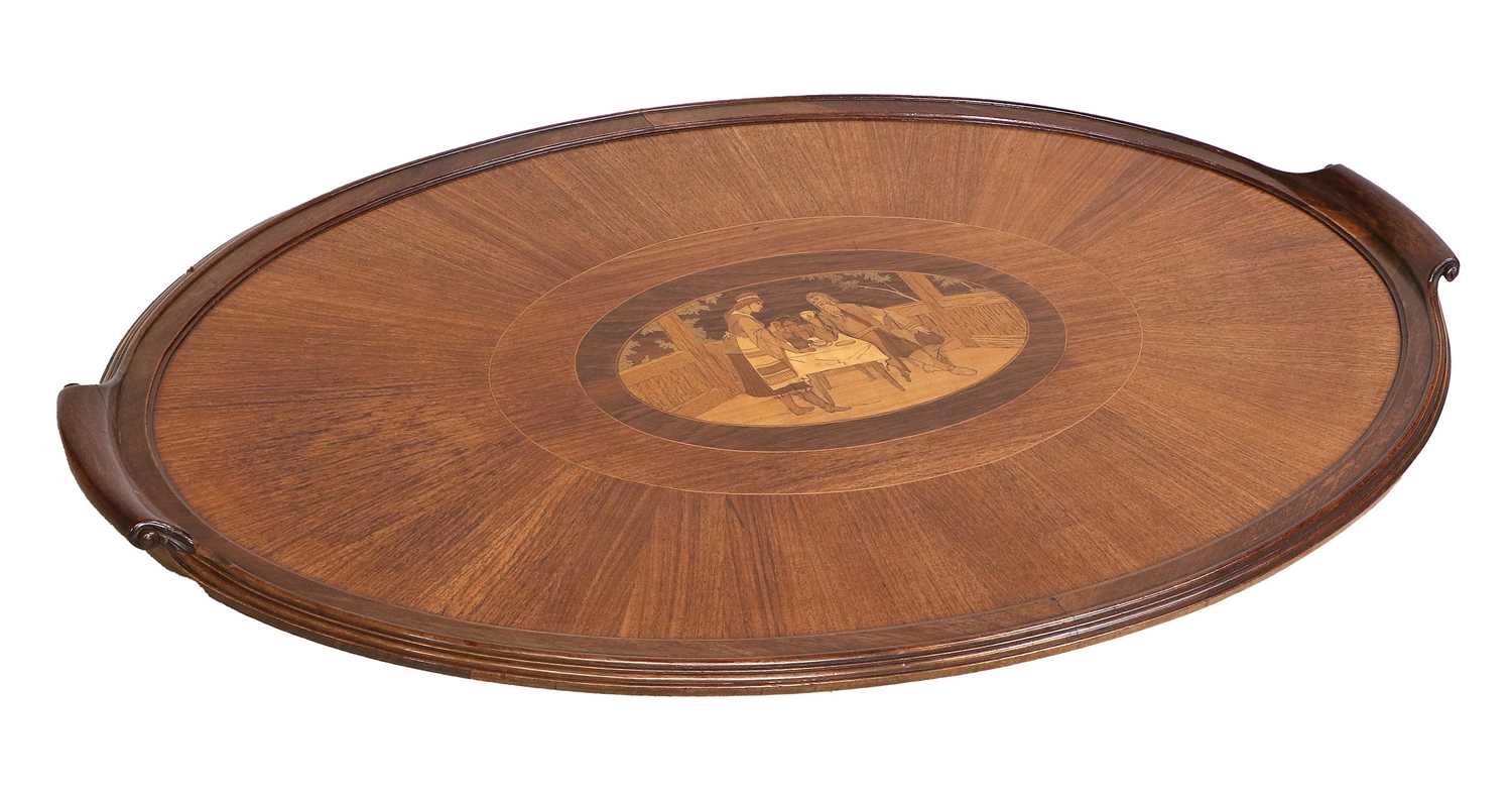 A Mahogany and Marquetry-Inlaid Oval Tray, circa 1900, with scrolled handles and moulded border, the