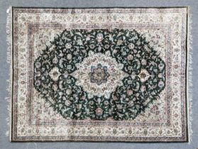 Modern Silk Carpet, India The bottle green of scrolling vines and palmettes centred by a