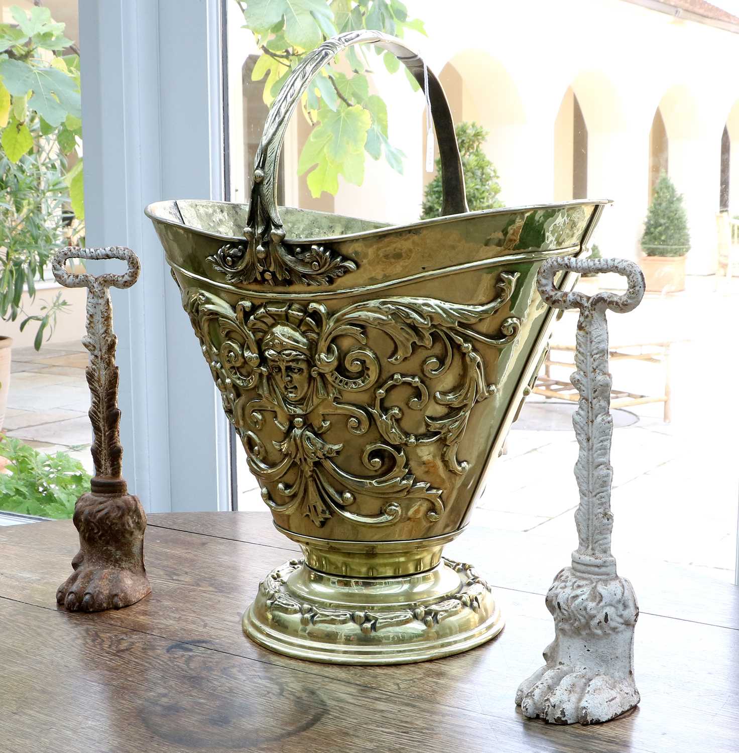 A Dutch Brass Coal Bucket, in Renaissance style, of oval form with leaf cast overhead handle over