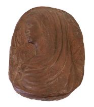 A Red Jasper Bas-Relief Plaque, probably Italian, 18th century, of oval form, carved with a bust