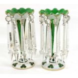 A Pair of Bohemian White Overlay Green Glass Table Lustres, circa 1860, of trumpet form on