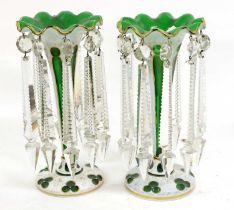 A Pair of Bohemian White Overlay Green Glass Table Lustres, circa 1860, of trumpet form on