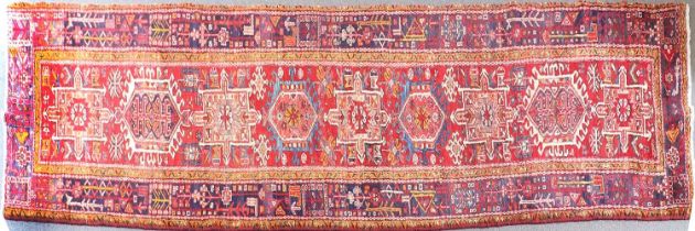 Heriz Runner Iranian Azerbaijan, circa 1950 The tomato red field with a column of hooked