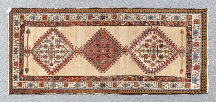 Sarab Rug North West Iran, circa 1930 The caramel ground with three hooked medallions enclosed by