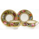 A Spode Teacup and Saucer, circa 1810, of bute shape, gilt ground and painted with large flowers