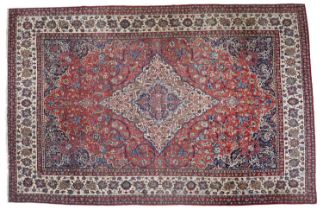 Isfahan Carpet Central Iran, circa 1950 The deep terracotta field with scrolling vines and