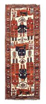 Unusual Lori Rug West Iran, circa 1940 The ivory field with large anthromorphic and zoomorphic