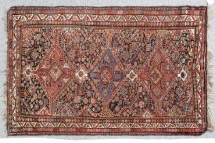 Kashgai Rug South West Iran, circa 1900 The charcoal field of tribal motifs and zoomorphic devices