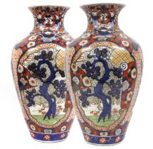 A Pair of Imari Porcelain Vases, Meiji period, of ovoid form and painted with panels containing pine