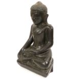 A Chinese Lacquered Wood Buddha, in Ming style, seated cross-legged on a shaped rectangular base