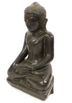 A Chinese Lacquered Wood Buddha, in Ming style, seated cross-legged on a shaped rectangular base