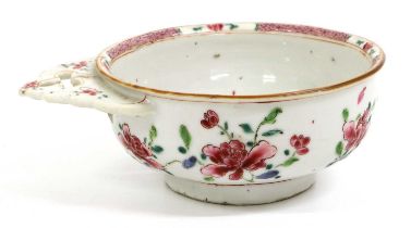 A Chinese Porcelain Porringer, Qianlong, with pierced and shaped handle, painted in famille rose