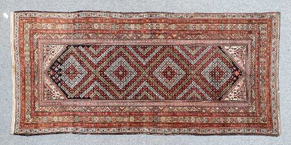 Malayir Khelleh West Iran, circa 1930 The indigo lozenge field with a diamond lattice of stylised