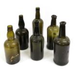 A Sealed Green Glass Wine Bottle, dated 1877, of cylindrical form with sloping shoulders moulded