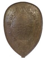 A Steel Wall Applique in the Form of a Shield, 2nd half 19th century, cast with soldiers storming