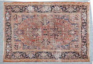 Heriz Carpet North West Iran, circa 1900 The terracotta field of angular vines around an indigo