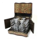 A French Boulle Travelling Decanter Set, circa 1860, of serpentine rectangular form, the hinged