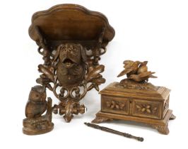 A Black Forest Carved Oak Wall Bracket, late 19th/20th century, the lobed demi-lune plinth over