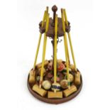 A Table Croquet Set, late 19th/early 20th century, comprising eight turned and painted mallets,
