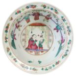 A Chinese Porcelain Basin, 19th century, with everted rim and painted in famille rose enamels with a
