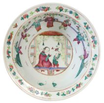 A Chinese Porcelain Basin, 19th century, with everted rim and painted in famille rose enamels with a