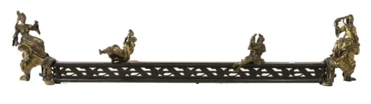 A Late 19th Century French Brass and Steel Fire Curb, the pierced fender surmounted by two figures