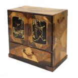 A Japanese Lacquer and Parquetry Kodansu (Table Cabinet), Meiji period, of rectangular form, the