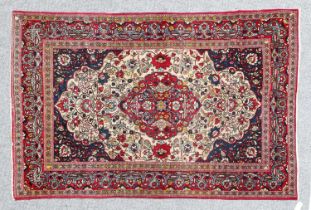 Isfahan Rug Central Iran, circa 1940 The ivory ground of scrolling vines centred by a cusped