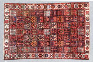 Bakhtiari Carpet West Iran, circa 1940 The compartmentalised field of flowers and plants enclosed by