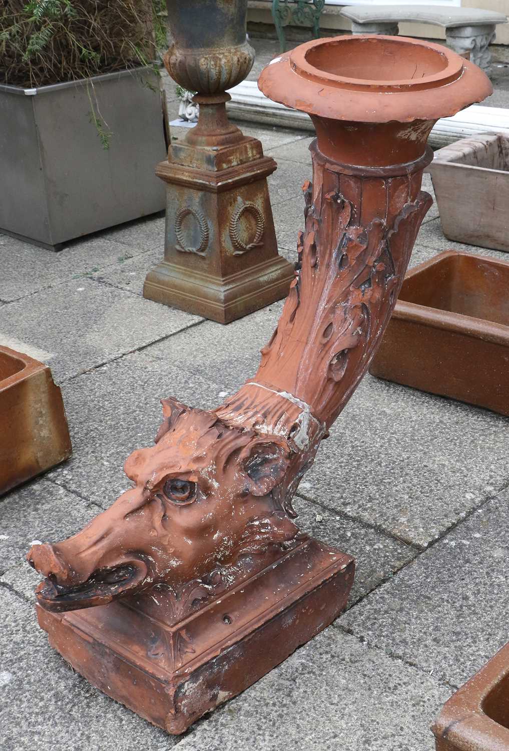 A Victorian Terracotta Garden Urn, late 19th century, as a boar's head issuing a cornucopia vase