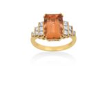 An 18 Carat Gold Orange Topaz and Diamond Ring the emerald-cut orange topaz in a yellow double