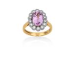 An 18 Carat Gold Pink Topaz and Diamond Cluster Ring the oval cut pink topaz in a white four claw