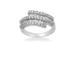 A Diamond Crossover Ring the white plain polished band terminating to rows of baguette cut