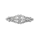 A Diamond Brooch the openwork lozenge motif set throughout with old cut, round brilliant cut and