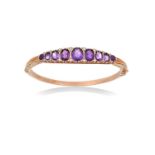 A 9 Carat Gold Amethyst and Split Pearl Hinged Bangle seven graduated oval cut amethysts flanked