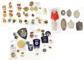 A Collection of Post-Second World War Military Badges, including Communist China, Russian and Polish