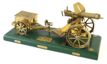 A Large Brass Model of a First World War Vickers Machine Gun, Carriage and Limber, the green painted