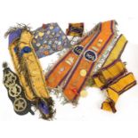 A Collection of 19th and 20th Century Orange Order Regalia, including forty lapel badges and tie