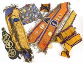 A Collection of 19th and 20th Century Orange Order Regalia, including forty lapel badges and tie