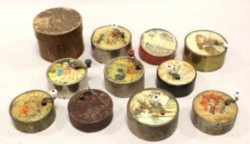 A Collection Of Circular Metal-Cased Manivelles