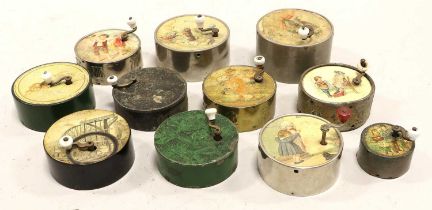 A Collection Of Circular Metal-Cased Manivelles