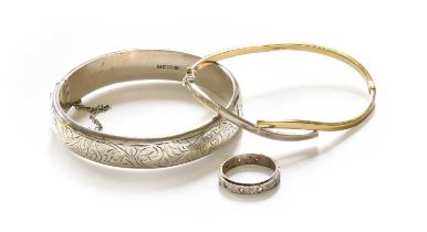 A 9 Carat Bi-Colour Gold Hinged Bangle, inner measurements 6.3cm by 4.6cm; A Silver Hinged Bangle,