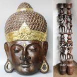 A Pair of Makonde Ebony Figural Candlesticks; a Large Carved Wood Buddhist Mask, (3)