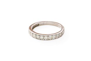 A 9 Carat White Gold Diamond Half Hoop Ring, twelve graduated round brilliant cut diamonds in claw